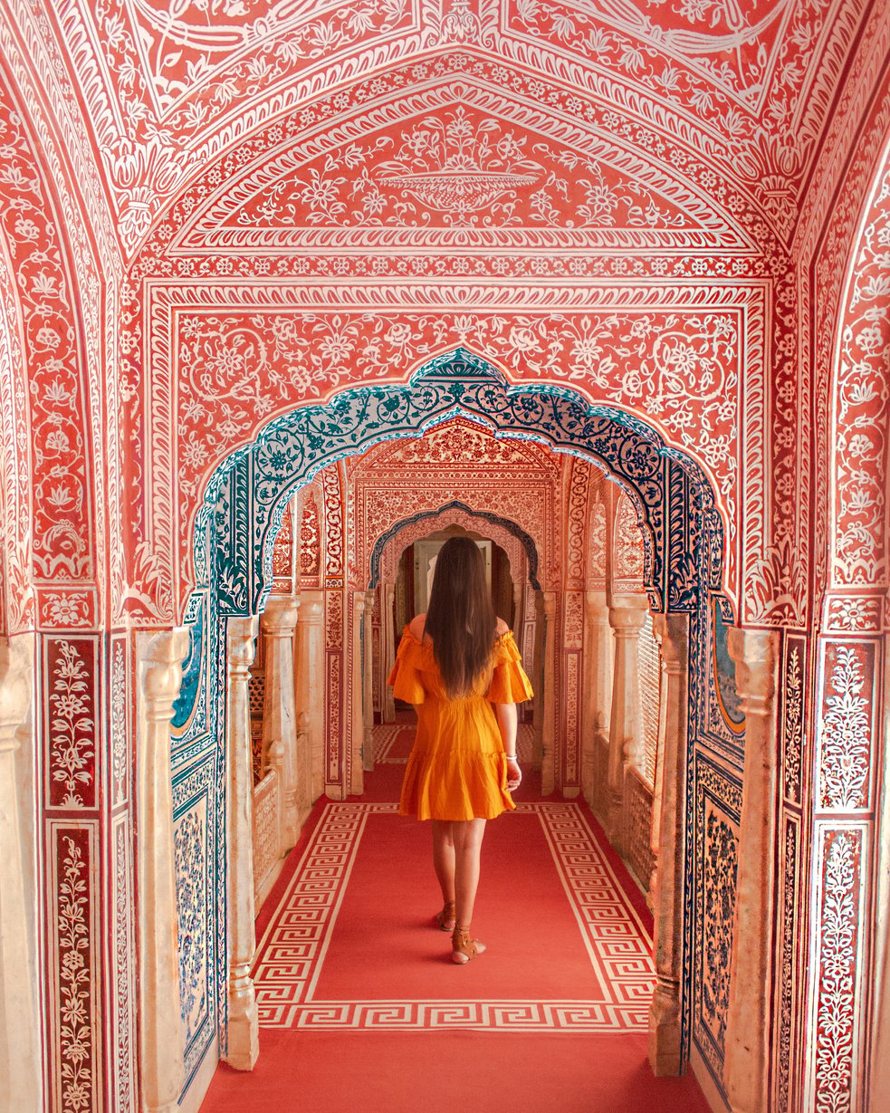 Woman Standing on Red Floor Rug